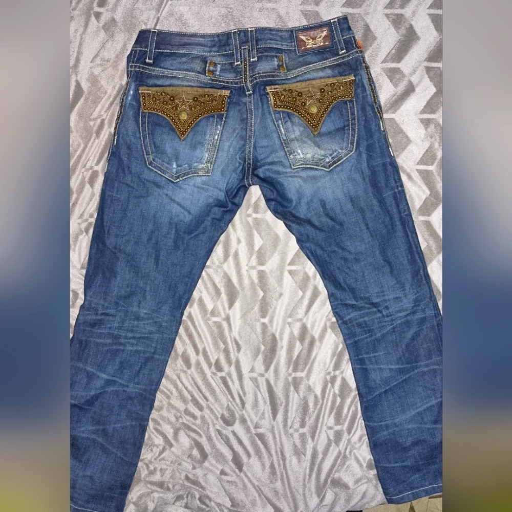 A dark blue Designer pair of Robin's Jeans, size 36